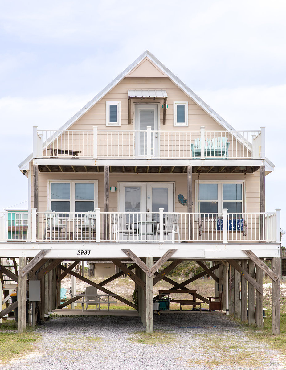 Front exterior of Jellyfish Twist, a raised beach house in Fort Morgan